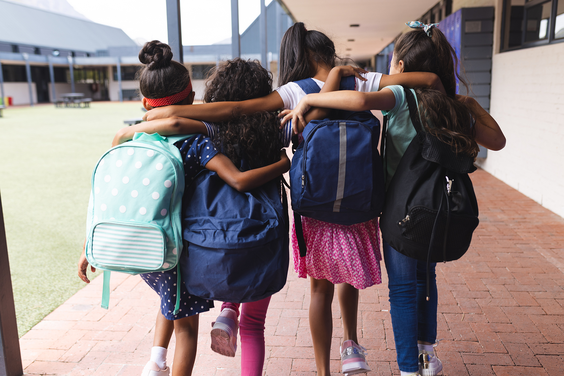 Four girls walking together.